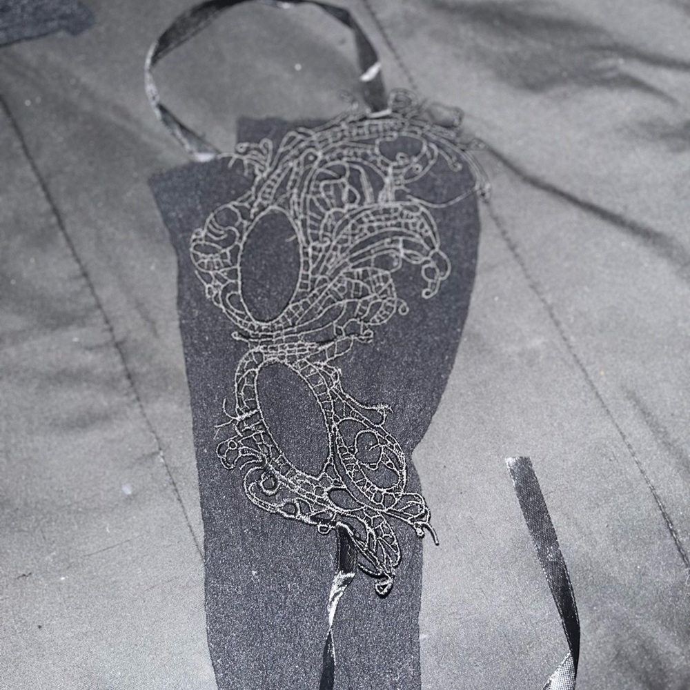 Elegant Black Dress with Intricate Design